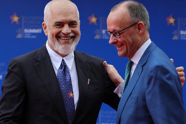 Albanian Prime Minister Edi Rama, left, welcomes Germany's Federal Chancellor Friedrich Merz ahead of a summit where the leaders of 47 European countries and organizations will discuss security, defense and democratic standards against the backdrop of Russia's war on Ukraine, in Tirana, Albania, Friday, May 16, 2025. (AP Photo/Vlasov Sulaj)
