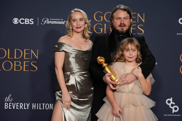 Mona Fastvold, from left, Ada Corbet, and Brady Corbet, winner of the award for best director - motion picture for "The Brutalist", pose in the press room during the 82nd Golden Globes on Sunday, Jan. 5, 2025, at the Beverly Hilton in Beverly Hills, Calif. (AP Photo/Chris Pizzello)