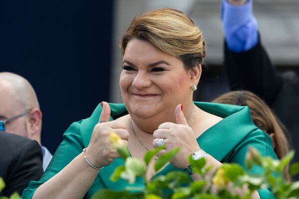 Jenniffer Gonzalez Colon gives a thumbs up during her swearing-in ceremony as governor outside the Capitol in San Juan, Puerto Rico, Thursday, Jan. 2, 2025. (AP Photo/Alejandro Granadillo)