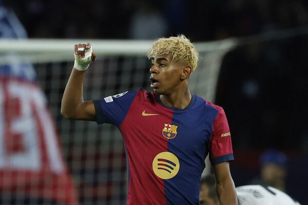 Barcelona's Lamine Yamal celebrates after scoring his side's opening goal during the Champions League semifinal first leg soccer match between Barcelona and Inter Milan at the Lluis Companys Olympic Stadium in Barcelona, Spain, Wednesday, April 30, 2025. (AP Photo/Joan Monfort)
