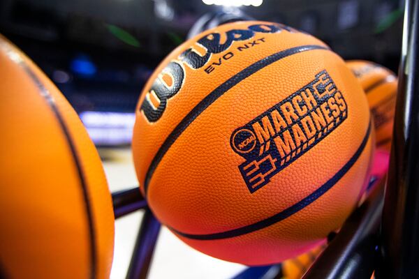 FILE - A basketball with a March Madness logo rests on a rack before a First Four game between Illinois and Mississippi State in the NCAA women's basketball tournament, March 15, 2023, in South Bend, Ind. (AP Photo/Michael Caterina, File)