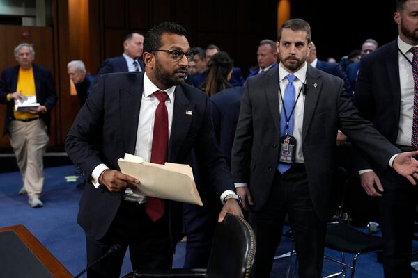 Kash Patel, President Donald Trump's choice to be director of the FBI, departs for a lunch break during his confirmation hearing before the Senate Judiciary Committee at the Capitol in Washington, Thursday, Jan. 30, 2025. (AP Photo/Ben Curtis)