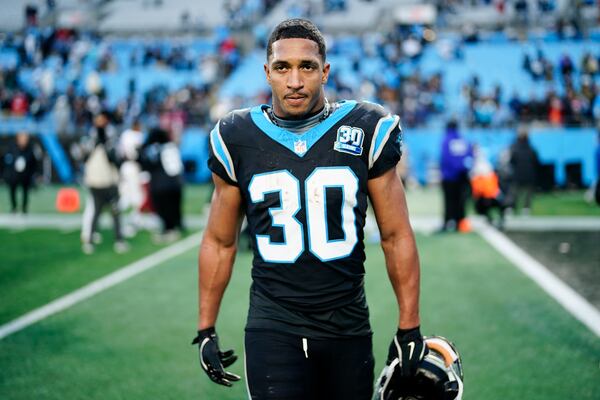 Carolina Panthers running back Chuba Hubbard leaves the field after scoring the winning touchdown against the Arizona Cardinals during overtime of an NFL football game, Sunday, Dec. 22, 2024, in Charlotte, N.C. (AP Photo/Jacob Kupferman)