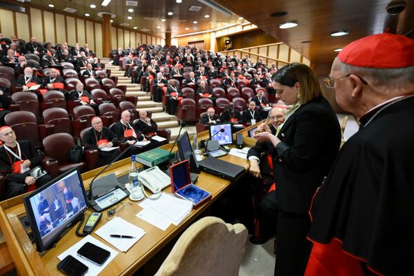 A Vatican employee annulls the papal seal on the pope's seal, at the Vatican, Tuesday, May 6, 2025. (Vatican Media via AP)