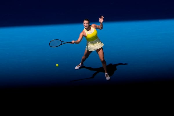 Aryna Sabalenka of Belarus returns a shot to Mirra Andreeva of Russia during their fourth round match at the Australian Open tennis championship in Melbourne, Australia, Sunday, Jan. 19, 2025. (AP Photo/Asanka Brendon Ratnayake)