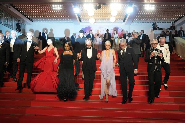 Editor Eddie Hamilton, from left, Hayley Atwell, Angela Bassett, Tom Cruise, Pom Klementieff, director Christopher McQuarrie, Simon Pegg and writer Erik Jendresen pose for photographers upon departure from the premiere of the film 'Mission: Impossible – The Final Reckoning' at the 78th international film festival, Cannes, southern France, Wednesday, May 14, 2025. (AP Photo/Natacha Pisarenko)