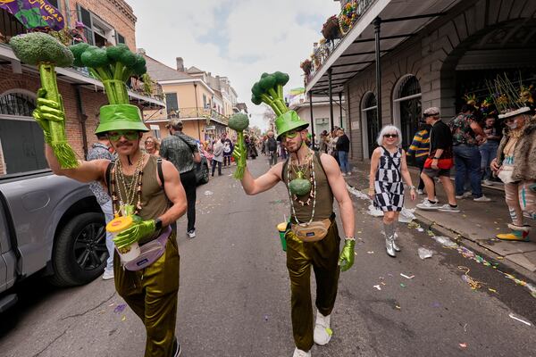 People dress as broccoli during the Society of Saint Anne's parade on Mardi Gras Day, Tuesday, March 4, 2025 in New Orleans. (AP Photo/Gerald Herbert)