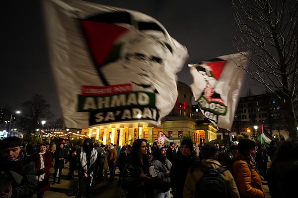 People gather to celebrate a long-awaited ceasefire that would pause the fighting in the Gaza Strip, Thursday, Jan. 16, 2025 in Paris. (AP Photo/Aurelien Morissard)