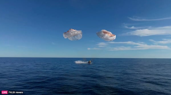 This image taken from video released by SpaceX shows a SpaceX capsule parachuting into the Gulf of Mexico, Tuesday, March 18, 2025. (SpaceX via AP)