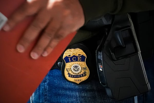 FILE - A deportation officer with U.S. Immigration and Customs Enforcement conducts a brief before an early morning operation, Dec. 17, 2024, in the Bronx borough of New York. (AP Photo/Julia Demaree Nikhinson, File)