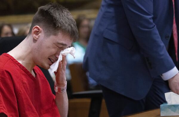 Chase Daniel Jones cries as attorney Brad Barshis gets up to read a letter Jones wrote to the families of his victims at the Maleng Regional Justice Center in Kent, Wash., Friday, April 25, 2025. (Ellen M. Banner/The Seattle Times via AP)