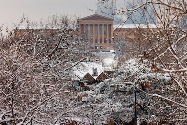 Snow covers the trees after an overnight show fall as the Philadelphia Museum of Art appears in the background in Philadelphia, Wednesday, Feb. 12, 2025. (Alejandro A. Alvarez/The Philadelphia Inquirer via AP)