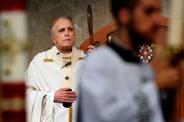 FILE - Cardinal Daniel DiNardo presides over a Mass of Ordination for seven candidates for the priesthood at the Co-Cathedral of the Sacred Heart in Houston, June 1, 2019. (AP Photo/David J. Phillip, File)