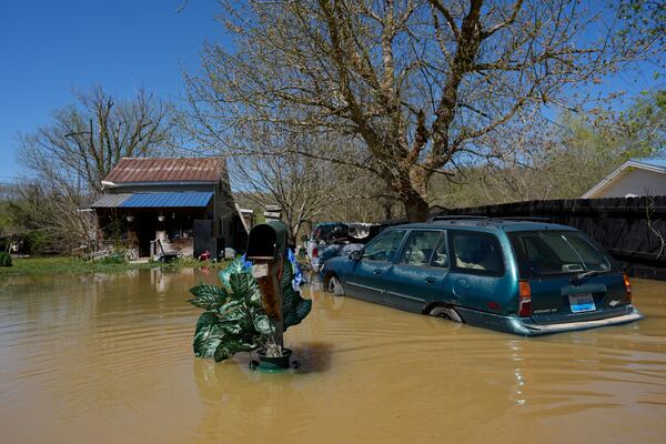 FILE - A home is flooded by the Kentucky River, Lockport, Ky., Tuesday, April 8, 2025. (AP Photo/Carolyn Kaster, File)