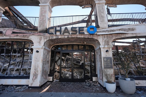 FILE - A Chase Bank branch destroyed by the Palisades Fire is seen in the Pacific Palisades neighborhood of Los Angeles, Monday, Jan. 13, 2025. (AP Photo/Richard Vogel, File)