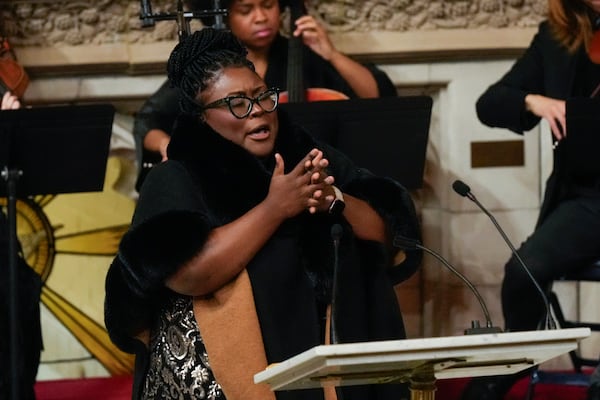 Nia Drummond, front, and The Nebulous String Quartet from Berklee College of Music perform during a ceremony in celebration of Roberta Flack's life at The Abyssinian Baptist Church on Monday, March 10, 2025, in New York. (AP Photo/Richard Drew)