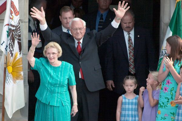 FILE - Gov. George Ryan waves as he and wife, Lura Lynn, greet to well-wishers from the steps of the Kankakee, Ill., County Courthouse in August 2001, where announced that he would not run for a second term as governor. (AP Photo/The (Kankakee) Daily Journal, File)