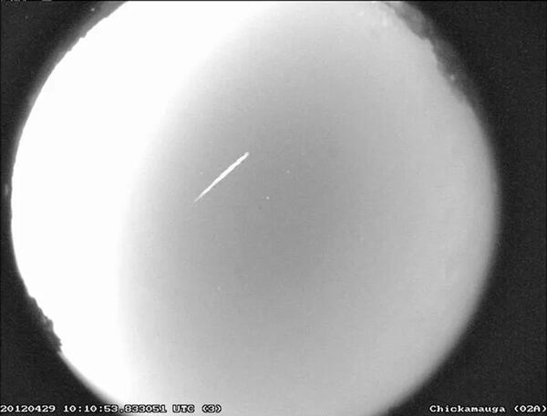 FILE - This photo provided by NASA shows an Eta Aquarid meteor streaking over northern Georgia on April 29, 2012. (B. Cooke/Marshall Space Flight Center/NASA via AP, File)