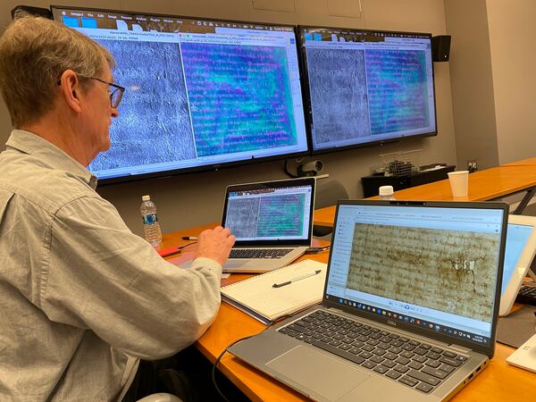 This photo provided by the Harvard Weissman Center shows imaging technology being used to help its librarians see details on a rare, faded copy of the Magna Carta from 1300 on March 19, 2024, in Cambridge, Mass. (Debora Mayer/Harvard Weissman Center via AP)