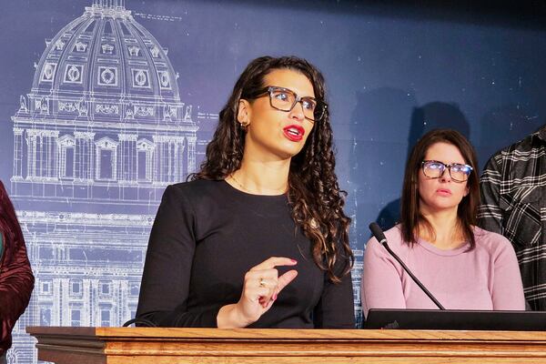 FILE - Minnesota Democratic State Senator Erin Maye Quade, center, speaks during a news conference at the Minnesota State Capitol in St. Paul, Feb. 24, 2025. (AP Photo/Steve Karnowski, File)