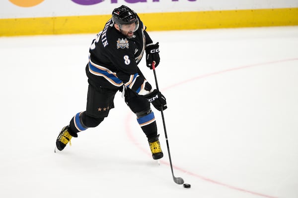 FILE - Washington Capitals left wing Alex Ovechkin (8) shoots the puck during the third period of an NHL hockey game against the Nashville Predators, Nov. 6, 2024, in Washington. (AP Photo/Nick Wass, File)