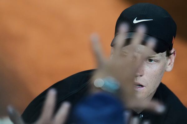 Italy's Jannik Sinner celebrates after defeating Argentina's Francisco Cerundolo in a round of sixteen match against at the Italian Open tennis tournament in Rome, Tuesday, May 13, 2025. (AP Photo/Andrew Medichini)