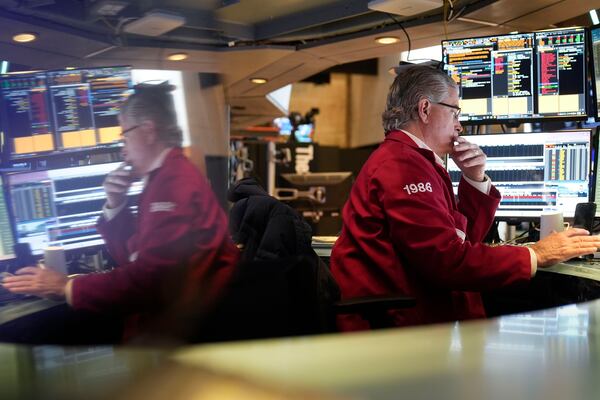 Traders work on the floor at the New York Stock Exchange in New York, Tuesday, Jan. 21, 2025. (AP Photo/Seth Wenig)