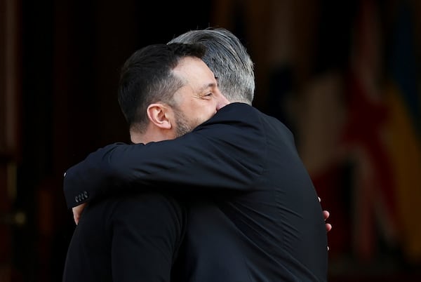 Britain's Prime Minister Keir Starmer, right, welcomes Ukrainian President Volodymyr Zelenskyy to the European leaders' summit to discuss Ukraine, at Lancaster House, London, Sunday March 2, 2025. (Toby Melville/Pool via AP)