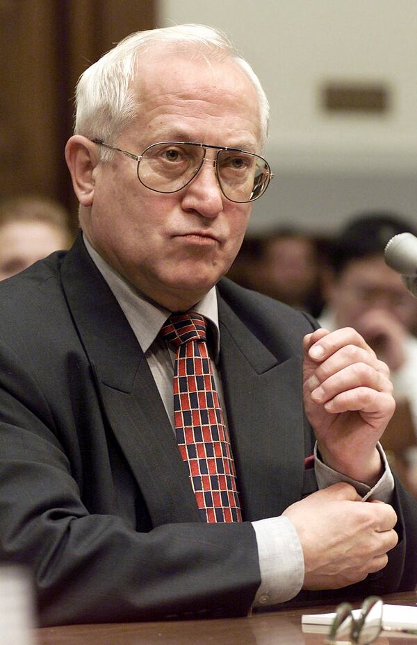 FILE - In this Oct. 26, 1999 file photo, Oleg Gordievsky, a former deputy head of the KGB in London, prepares to testify before a House Armed Services Subcommittee in Washington. He died March 4 in England at the age of 86. (AP Photo/Dennis Cook, File)