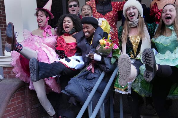 Cynthia Erivo, center, Harvard University's Hasty Pudding Theatricals Woman of the Year, dances while flanked by character actors following a parade in her honor, Wednesday, Feb. 5, 2025, in Cambridge, Mass. (AP Photo/Charles Krupa)