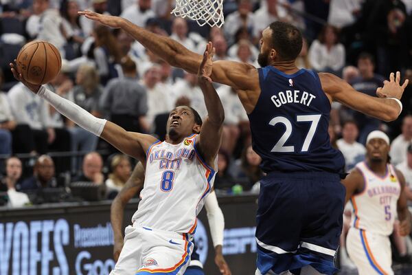 Oklahoma City Thunder forward Jalen Williams (8) shoots against Minnesota Timberwolves center Rudy Gobert (27) during the second half of Game 4 of the Western Conference finals of the NBA basketball playoffs Monday, May 26, 2025, in Minneapolis. (AP Photo/Matt Krohn)
