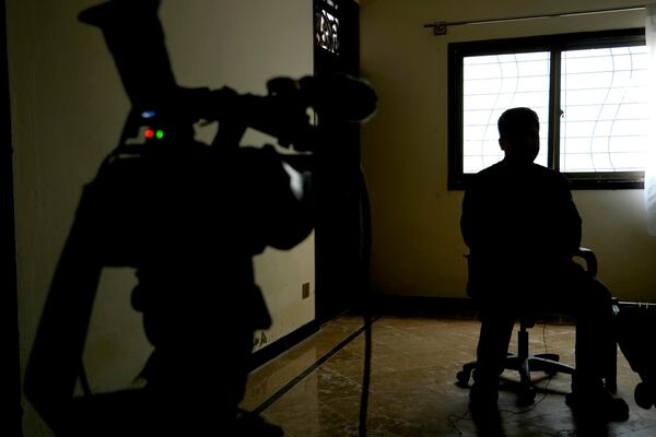 An Afghan refugee man, who asked not to use his name and not to show his face fearing his identity could lead to his capture, speaks during an interview with The Associated Press, in Islamabad, Pakistan, Wednesday, Jan. 22, 2025. (AP Photo/Anjum Naveed)