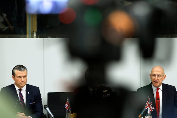 United States Secretary of Defense Pete Hegseth, left, and Britain's Defense Secretary John Healey attend a meeting of the Ukraine Defense Contact group at NATO headquarters in Brussels, Wednesday, Feb. 12, 2025. (AP Photo/Omar Havana)