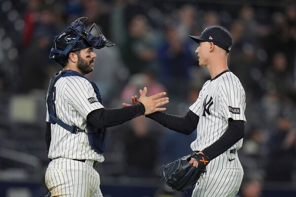 New York Yankees pitcher Luke Weaver, right, celebrates with catcher Austin Wells after a baseball game against the Texas Rangers Tuesday, May 20, 2025, in New York. (AP Photo/Frank Franklin II)