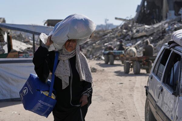 Displaced Palestinians fleeing Beit Lahia amid ongoing Israeli military operations in the Gaza Strip arrive in Jabalia, northern Gaza, on Friday, May 16, 2025. (AP Photo/Jehad Alshrafi)