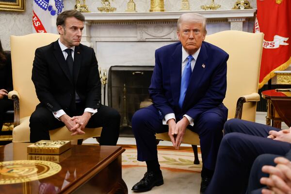 President Donald Trump, right, meets with France's President Emmanuel Macron in the Oval Office of the White House in Washington, Monday, Feb. 24, 2025. (Ludovic Marin/Pool via AP)