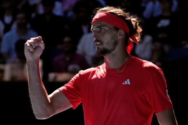 Alexander Zverev of Germany reacts after winning the first set in his semifinal match against Novak Djokovic of Serbia at the Australian Open tennis championship in Melbourne, Australia, Friday, Jan. 24, 2025. (AP Photo/Asanka Brendon Ratnayake)