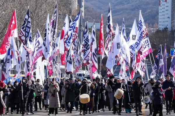 Supporters of impeached South Korean President Yoon Suk Yeol march during a rally to oppose his impeachment near the Corruption Investigation Office for High-Ranking Officials in Gwacheon, South Korea, Wednesday, Jan. 15, 2025. (AP Photo/Ahn Young-joon)