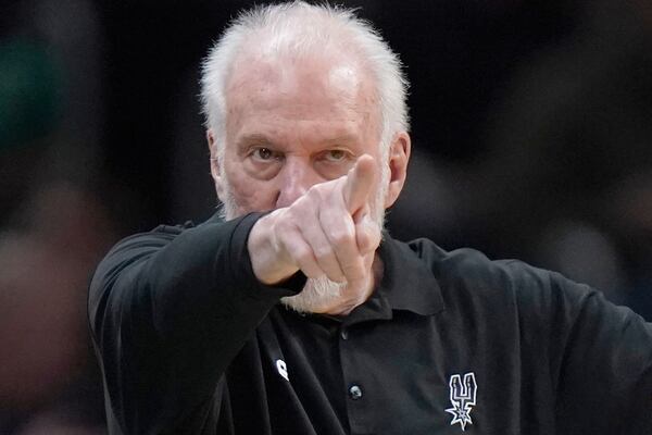 FILE - San Antonio Spurs head coach Gregg Popovich points from the bench in the second half of an NBA basketball game against the Boston Celtics, Sunday, March 26, 2023, in Boston. (AP Photo/Steven Senne, File)