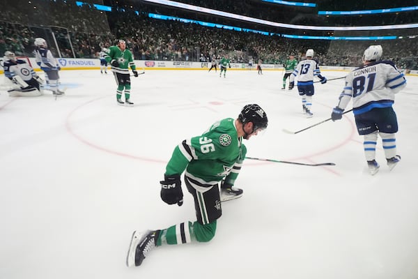 Dallas Stars' Mikko Rantanen (96) celebrates his goal in the third period of Game 3 of a second-round NHL hockey playoff series against the Winnipeg Jets in Dallas, Sunday, May 11, 2025. (AP Photo/Julio Cortez)