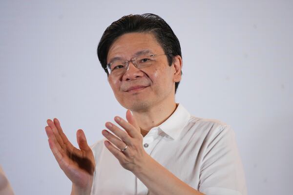 Prime Minister Lawrence Wong's, from the People's Action Party (PAP), thanks his supporters and voters at an assembly area for People's Action Party supporters, on the day of the general election in Singapore, Saturday, May 3, 2025. (AP Photo/Vincent Thian)