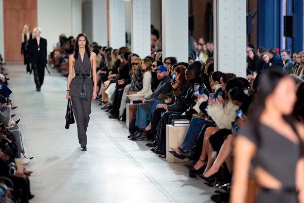 Models walk the runway during the Michael Kors Fall/Winter 2025 fashion show as part of New York Fashion Week on Tuesday, Feb. 11, 2025, at Terminal Warehouse in New York. (Photo by Charles Sykes/Invision/AP)