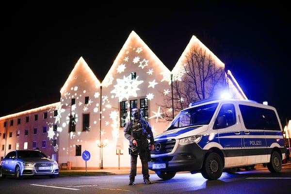 A police officer guards at a blocked road near a Christmas market after an incident in Magdeburg, Germany, Friday, Dec. 20, 2024. (AP Photo/Ebrahim Noroozi)