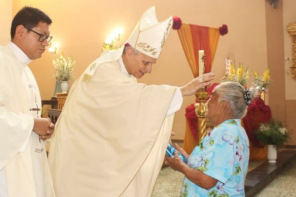In this photo released by the Cruz de Motupe Brotherhood, Bishop Robert Prevost, who was elected Pope Leo XIV on May 8, 2025, blesses a woman during a Mass in Motupe, Peru, in September 2020. (Cruz de Motupe Brotherhood via AP)