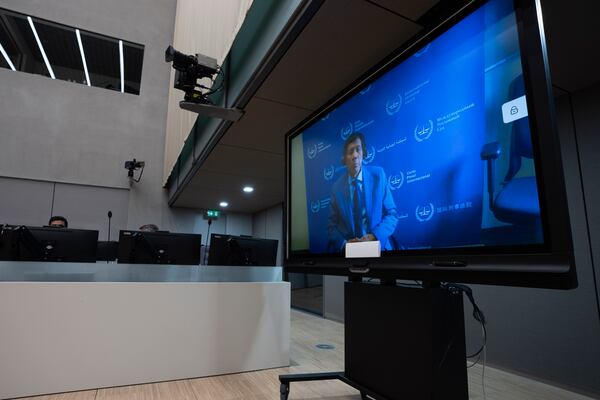 Former Philippine President Rodrigo Duterte is seen on a screen in the courtroom of the International Criminal Court (ICC) in The Hague, Netherlands, Friday, March 14, 2025. (AP Photo/Peter Dejong, Pool)