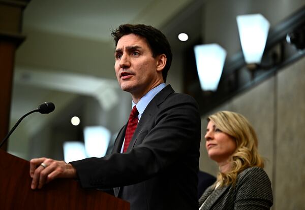 Canadian Prime Minister Justin Trudeau addresses media members after U.S. President Donald Trump signed an order to impose stiff tariffs on imports from Mexico, Canada and China, in Ottawa, Canada, Saturday, Feb. 1, 2025. (Justin Tang/The Canadian Press via AP)