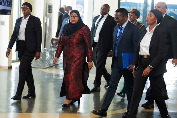 Tanzania President Samia Suluhu, center left, arrives to attends a joint summit to address conflict in Eastern Democratic Republic of Congo, hosted by the Southern African Development Community (SADC) and the East Africa Community (EAC) in Dar es Salaam, Tanzania Saturday, Feb. 8, 2025. (AP Photo/Elia Yunga)