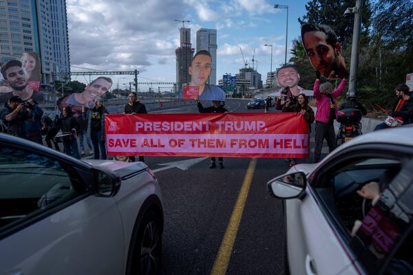 Relatives and supporters of Israelis held hostage in the Gaza Strip, block a higway during a protest demanding their release from Hamas captivity, in Tel Aviv, Israel, Thursday, Feb. 13, 2025. (AP Photo/Oded Balilty)