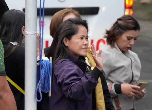 Mary Jane Veloso, a Filipino woman who spent almost 15 years in an Indonesian prison for drug trafficking and was nearly executed by firing squad in 2015, arrives at the Correctional Institution for Women in Mandaluyong, Philippines, Wednesday, Dec. 18, 2024. (AP Photo/Aaron Favila)