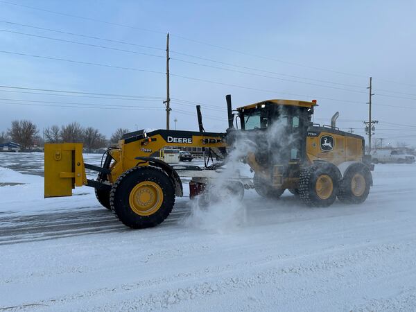 A snowplow clears a street on Thursday, Dec. 19, 2024, in Bismarck, N.D. (AP Photo/Jack Dura)